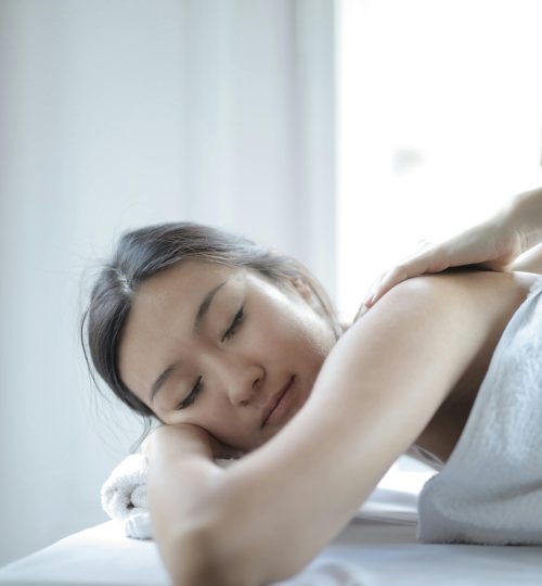 Photo of Woman Getting a Back Massage